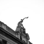 Black and white photo of a sculpture on Strasbourg's historic architecture.