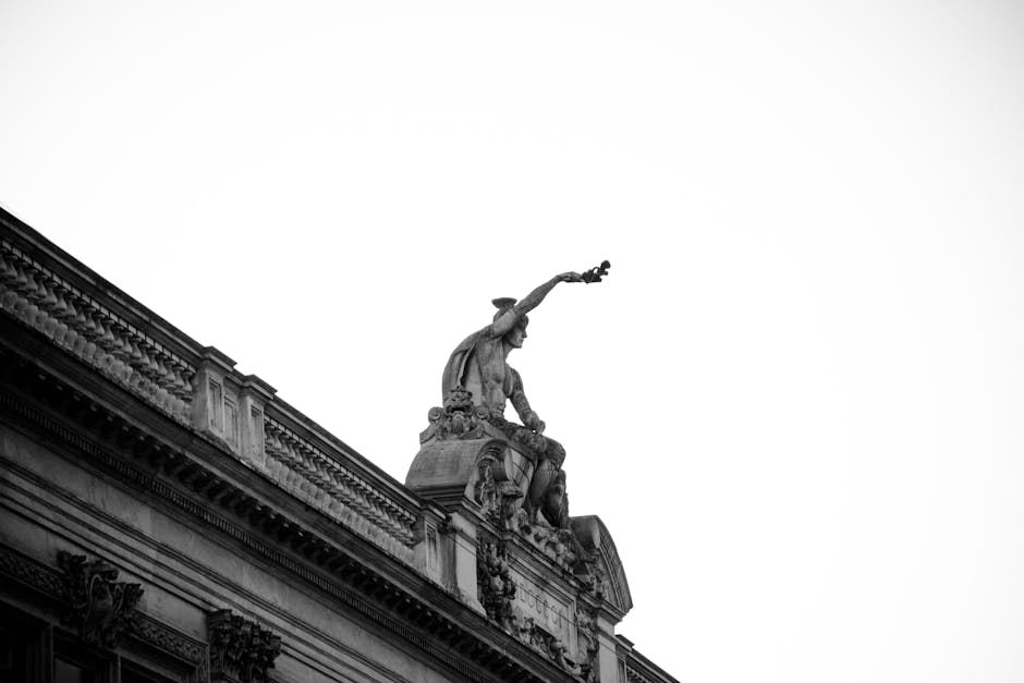 Black and white photo of a sculpture on Strasbourg's historic architecture.