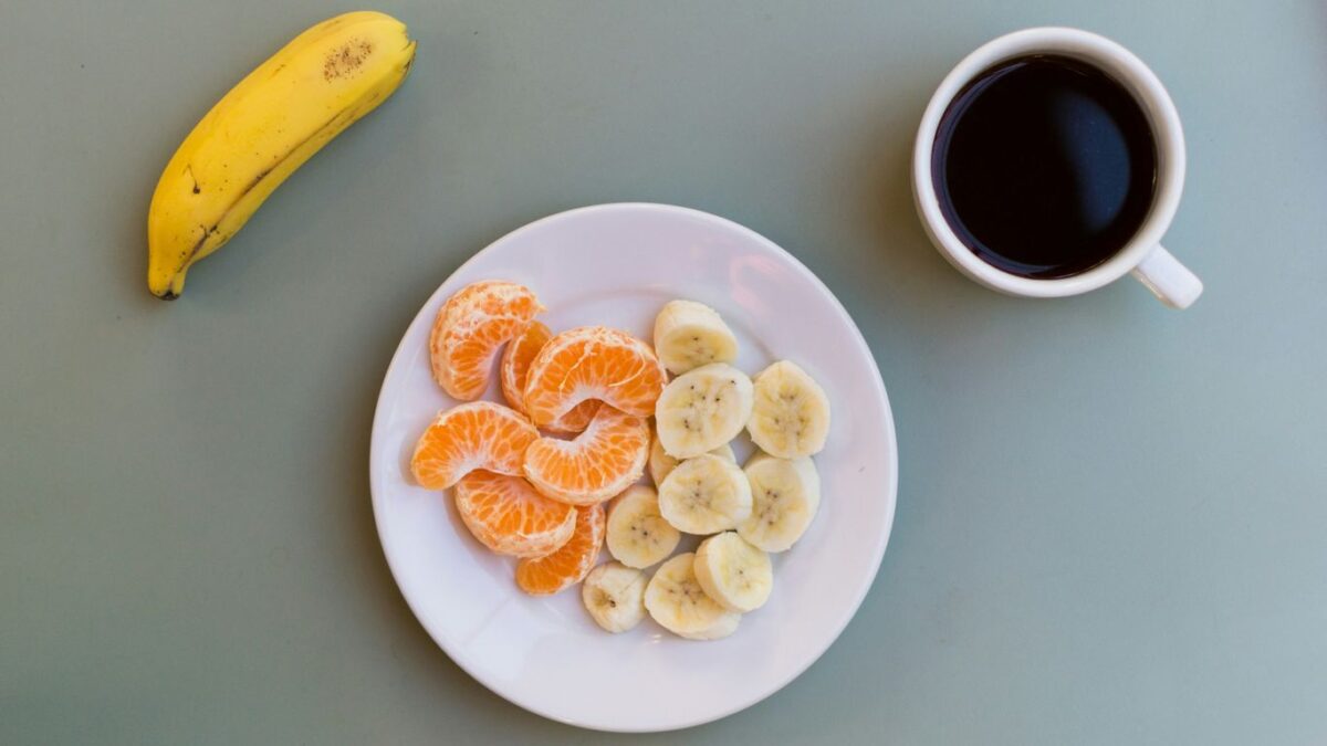 yellow banana fruit on white ceramic plate