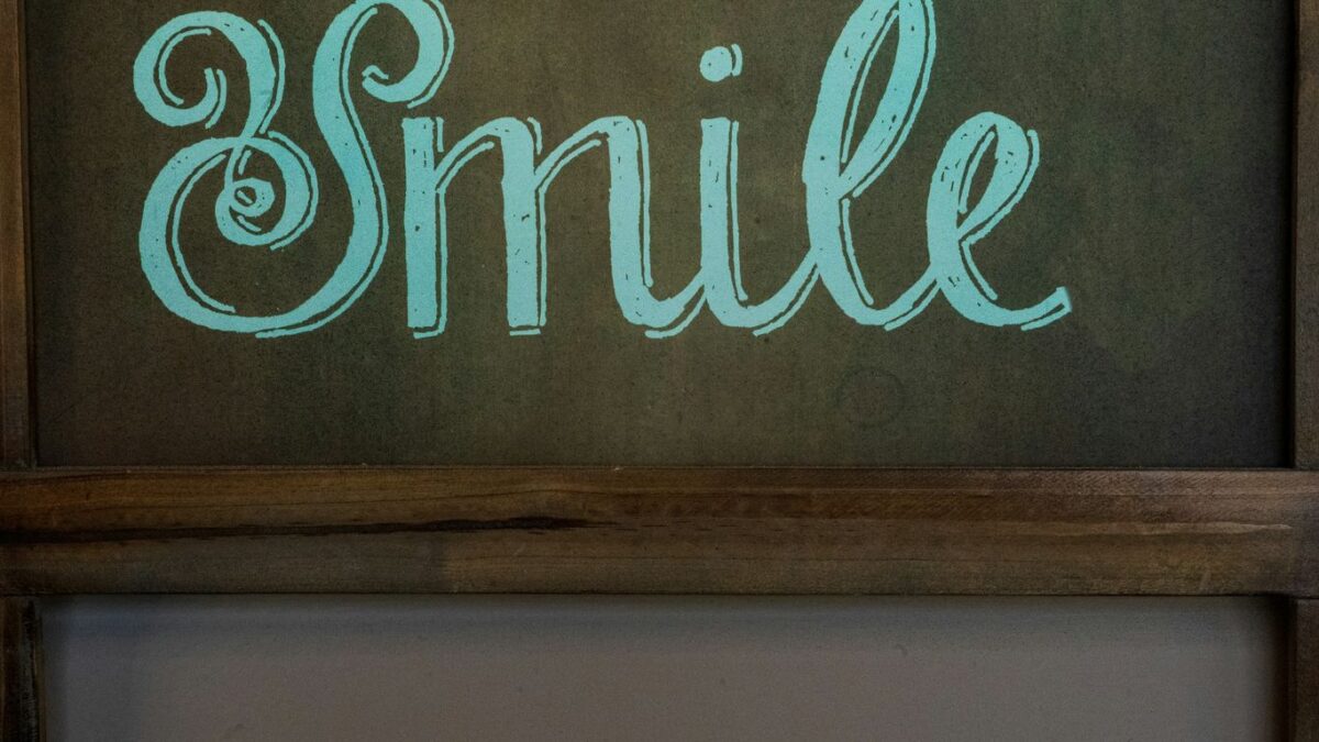 brown wooden wall mounted signage