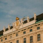 A large building with statues on top of it