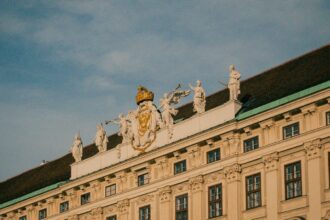 A large building with statues on top of it