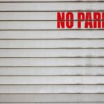 a no parking sign on a garage door