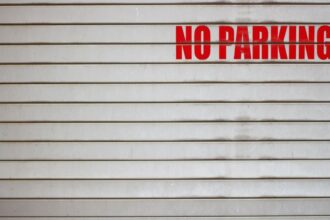 a no parking sign on a garage door