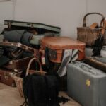 a pile of luggage sitting on top of a hard wood floor