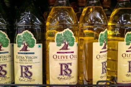Bottles of olive oil on a shelf