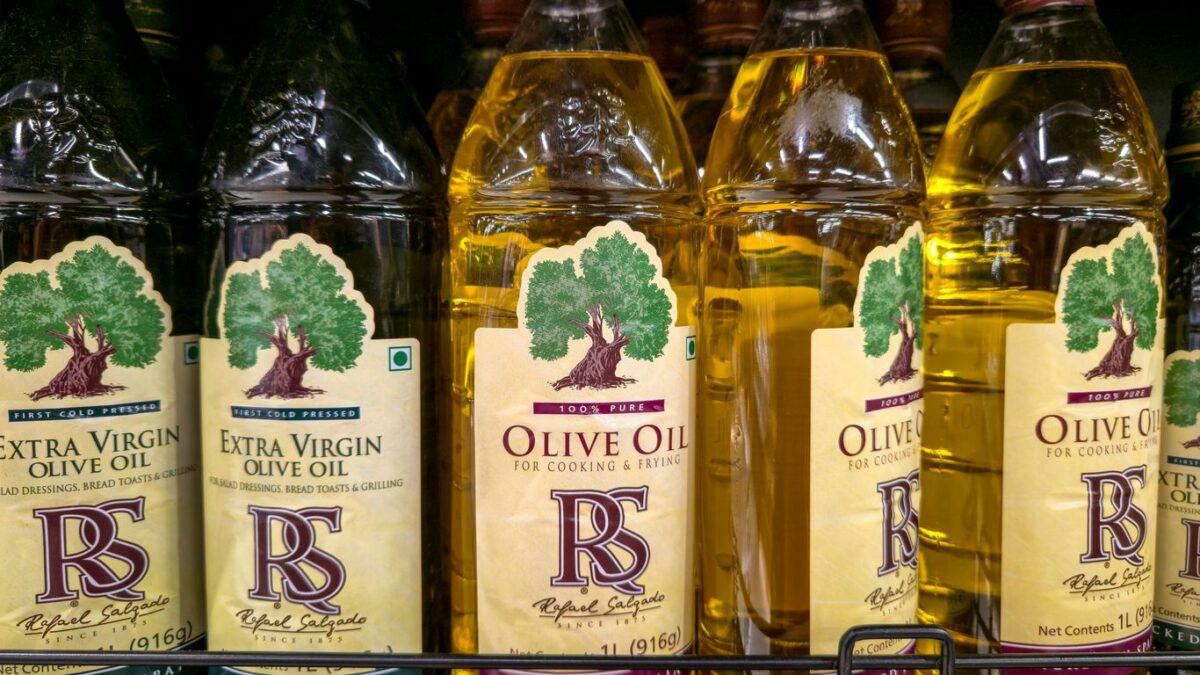 Bottles of olive oil on a shelf