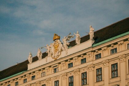 A large building with statues on top of it