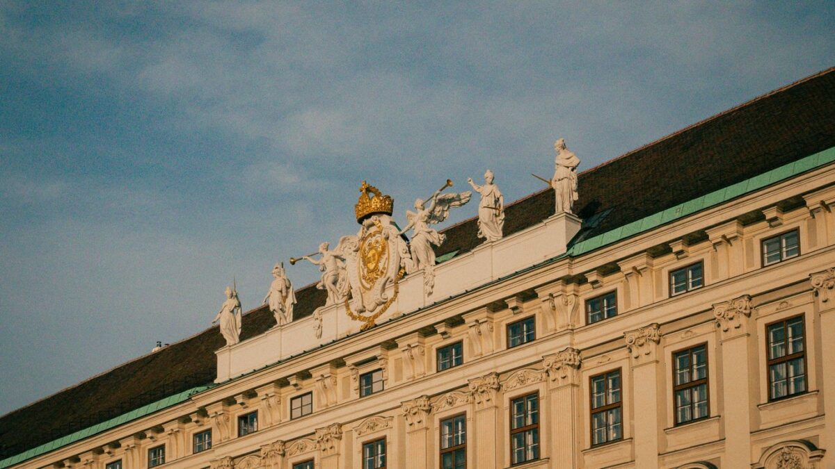 A large building with statues on top of it