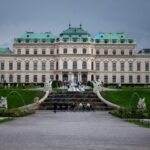 a large building with a fountain in front of it
